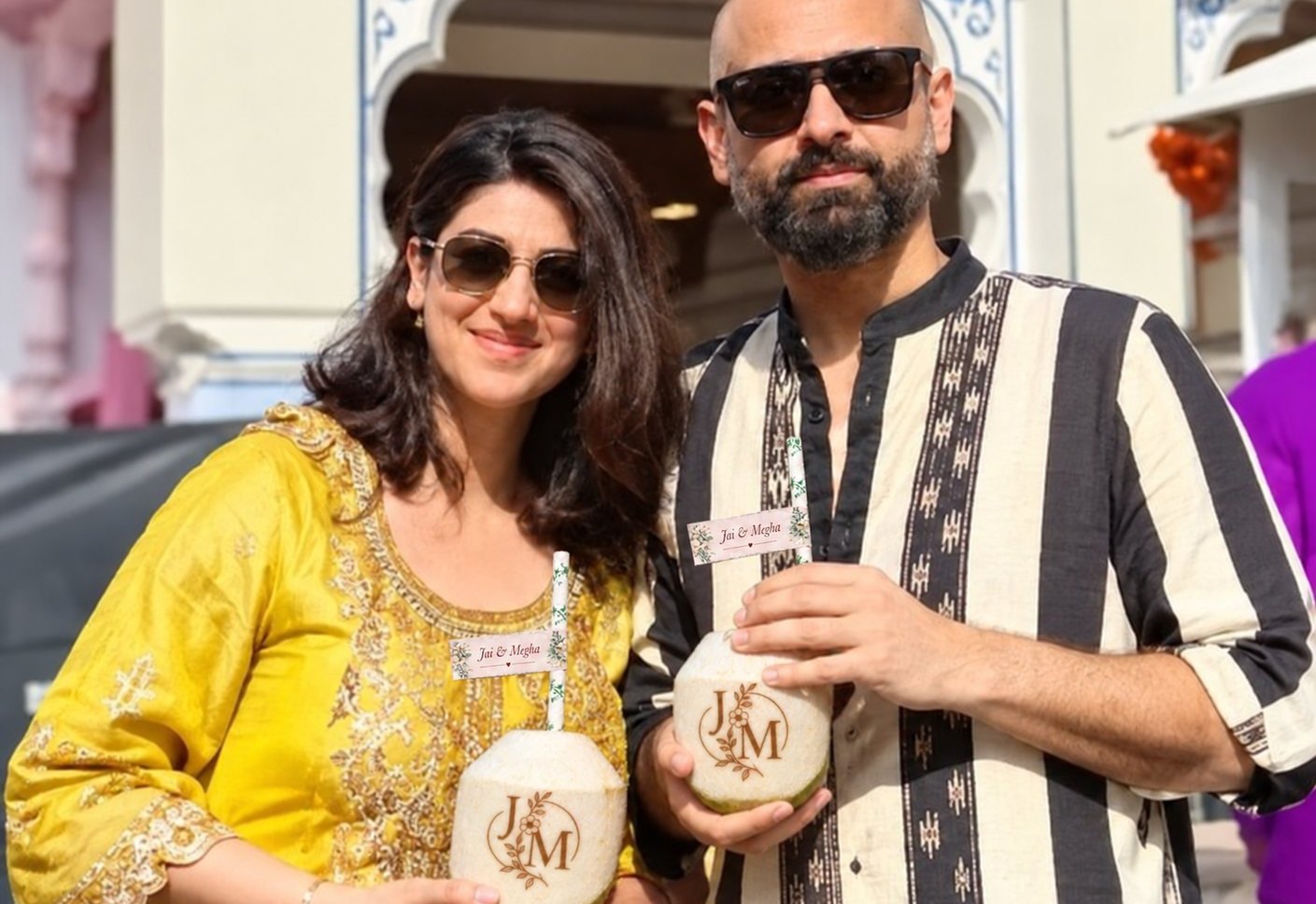 Guests enjoying fresh branded coconuts with custom logos at party